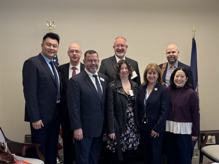 L-R Tim Zhao, Stuart Holt, Jay Dick, John Good, Erin Harms, Delegate Gretchen Bulova, Damon Effingham, Allison Mui