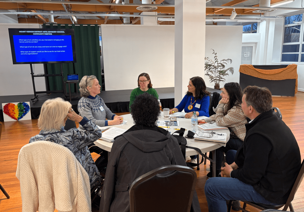 Members of the Mount Vernon District Arts Advisory Council gather around a table for their first meeting at the Workhouse Arts Center.