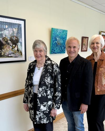 Artists of the Lake Barcroft Art League stand with their work at Lincolnia Senior Center