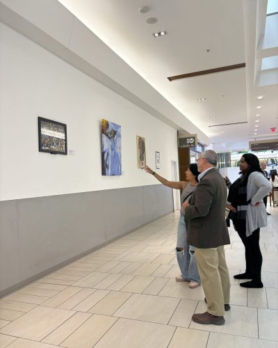 Patrons admire the artwork at Springfield Town Center